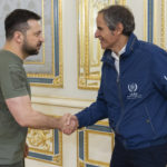 
              In this photo provided by the Ukrainian Presidential Press Office, Ukrainian President Volodymyr Zelenskyy, left, shakes hands with International Atomic Energy Agency (IAEA) Director General Rafael Mariano Grossi during their meeting in Kyiv, Ukraine, Thursday, Oct. 6, 2022. (Ukrainian Presidential Press Office via AP)
            