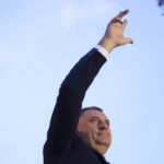 
              Bosnian Serb leader and member of the Bosnian Presidency Milorad Dodik waves with three fingers to the crowd of thousands who gathered to support the "people's rally for the defense of Republika Srpska" protest in Banja Luka, Bosnia, Tuesday, Oct. 25, 2022. Tens of thousands of people rallied in Bosnia Tuesday to demand from electoral authorities to end a recount of ballots cast in one of the races in the country’s Oct. 2 general election and confirm a staunchly pro-Russian politician as the president of its Serb-run part.(AP Photo/Armin Durgut)
            