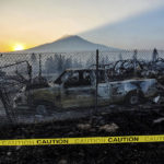 
              FILE - The sun rises over Mt. Shasta and homes destroyed by the Mill Fire on Saturday, Sept. 3, 2022, in Weed, Calif. Robert Davies, who lost his home in the fire is suing Roseburg Forest Products Co., over the start of the fire alleging the wood products company failed to address on-site risks. The suit was filed in San Francisco Superior Court, Tuesday, Oct. 4, 2022. (AP Photo/Noah Berger, File)
            