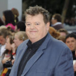 
              FILE - Robbie Coltrane arrives in Trafalgar Square, central London, for the world premiere of "Harry Potter and The Deathly Hallows: Part 2," the last film in the series on July 7, 2011. Coltrane, who played a forensic psychologist on TV series “Cracker” and Hagrid in the “Harry Potter” movies, has died. Coltrane’s agent Belinda Wright said he died Friday at a hospital in Scotland. He was 72. (AP Photo/Jonathan Short, File)
            