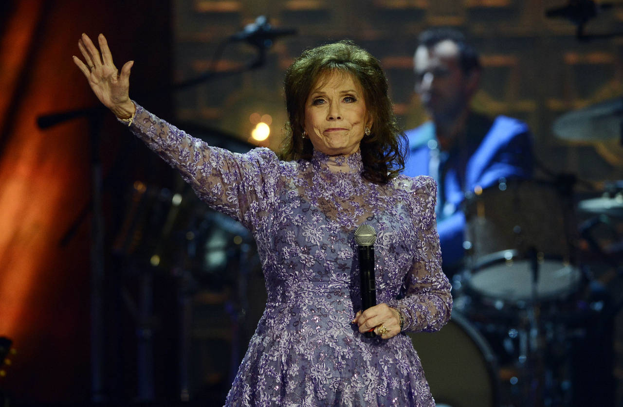 FILE - Loretta Lynn waves to the crowd after performing during the Americana Music Honors and Award...