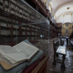 
              The interior of Palafoxiana library,  the oldest public library in the Americas, in Puebla, Mexico, Tuesday, Sept. 13, 2022. The walls were fitted with two tiers of wooden bookshelves; a third tier was added in the 19th century as donations flowed in from religious leaders and laypeople. There are now more than 45,000 volumes and manuscripts. (AP Photo/Pablo Spencer)
            
