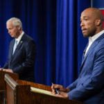 
              U.S. Sen. Ron Johnson, R-Wis., left, and his Democratic challenger Mandela Barnes wait for start of a televised debate, Friday, Oct. 7, 2022, in Milwaukee. (AP Photo/Morry Gash)
            