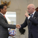 
              Indonesian President Joko Widodo, left, shakes hands with FIFA President Gianni Infantino during their meeting at Merdeka Palace in Jakarta, Indonesia, Tuesday, Oct. 18, 2022. (AP Photo/Achmad Ibrahim)
            