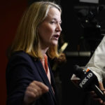 
              Democrat Kris Mayes, candidate Arizona Attorney General, speaks with the media after a televised debate against Republican Abraham Hamadeh, Wednesday, Sept. 28, 2022. (AP Photo/Ross D. Franklin)
            