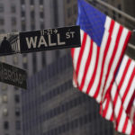 
              FILE - American flags fly outside the New York Stock Exchange, Friday, Sept. 23, 2022, in New York.   (AP Photo/Mary Altaffer, File)
            