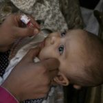 
              A health worker administers a polio vaccine to a child in Peshawar, Pakistan, Monday, Oct. 24, 2022. (AP Photo/Muhammad Sajjad)
            