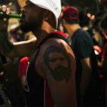 
              A supporter of Brazil's former President Luiz Inacio Lula da Silva, dons a tattoo of Lula on his forearm, as he waits for results after polls closed in the country's presidential run-off election, in Sao Paulo, Brazil, Sunday, Oct. 30, 2022. On Sunday, Brazilians had to choose between da Silva and incumbent Jair Bolsonaro, after neither got enough support to win outright in the Oct. 2 general election.(AP Photo/Matias Delacroix)
            