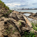 
              The remains of a ship lay on the banks of the Mississippi River in Baton Rouge, La., on Monday, Oct. 17, 2022, after recently being revealed due to the low water level. The ship, which archaeologists believe to be a ferry that sunk in the late 1800s to early 1900s, was spotted by a Baton Rouge resident walking along the shore earlier this month.  (AP Photo/Sara Cline)
            
