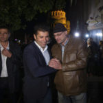 
              Kiril Petkov, center left, leader of "We Continue the Change," is comforted by a supporter after conceding defeat late Sunday in capital Sofia, Bulgaria, Sunday, Oct. 2, 2022. An exit poll in Bulgaria suggested Sunday that the center-right GERB party of ex-premier Boyko Borissov, a party blamed for presiding over years of corruption, will be the likely winner of the country's parliamentary election. (AP Photo/Visar Kryeziu)
            