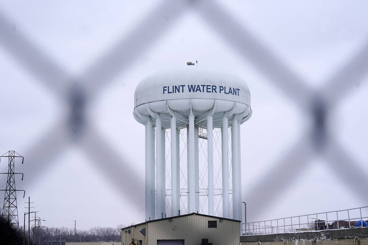 FILE - The Flint water plant tower is seen on Jan. 6, 2022, in Flint, Mich.  A Michigan judge dismi...