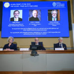 
              Secretary General of the Royal Swedish Academy of Sciences Hans Ellegren, centre, Eva Olsson, left and Thors Hans Hansson, members of the Nobel Committee for Physics announce the winner of the 2022 Nobel Prize in Physics, from left to right on the screen, Alain Aspect, John F. Clauser and Anton Zeilinger, during a press conference at the Royal Swedish Academy of Sciences, in Stockholm, Sweden, Tuesday, Oct. 4, 2022. (Jonas Ekstromer /TT News Agency via AP)
            