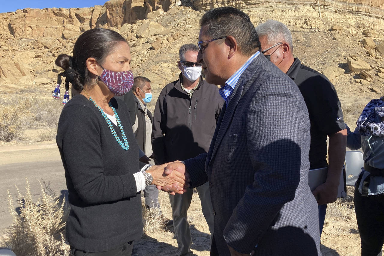 FILE - Hopi Vice Chairman Clark Tenakhongva, right, talks to UnitedStates Interior Secretary Deb Ha...