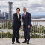 
              Japan's Prime Minister Fumio Kishida, left, shakes hands with Australian Prime Minister Anthony Albanese in Perth, Australia, Saturday, Oct. 22, 2022. Kishida is on a visit is to bolster military and energy cooperation between Australia and Japan amid their shared concerns about China. (Stefan Gosatti/Pool Photo via AP)
            