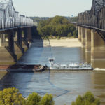 
              FILE - A boat navigates the Mississippi River in Vicksburg, Oct. 11, 2022. The unusually low water level in the lower Mississippi River has caused some barges to get stuck in the muddy river bottom, resulting in delays. (AP Photo/Rogelio V. Solis, File)
            