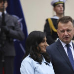 
              Defense Minister of Poland Mariusz Blaszczak, right, welcomes Canada's Minister of National Defense Anita Anand, left, in Warsaw, Poland, Tuesday, Oct. 11, 2022. (AP Photo/Michal Dyjuk)
            