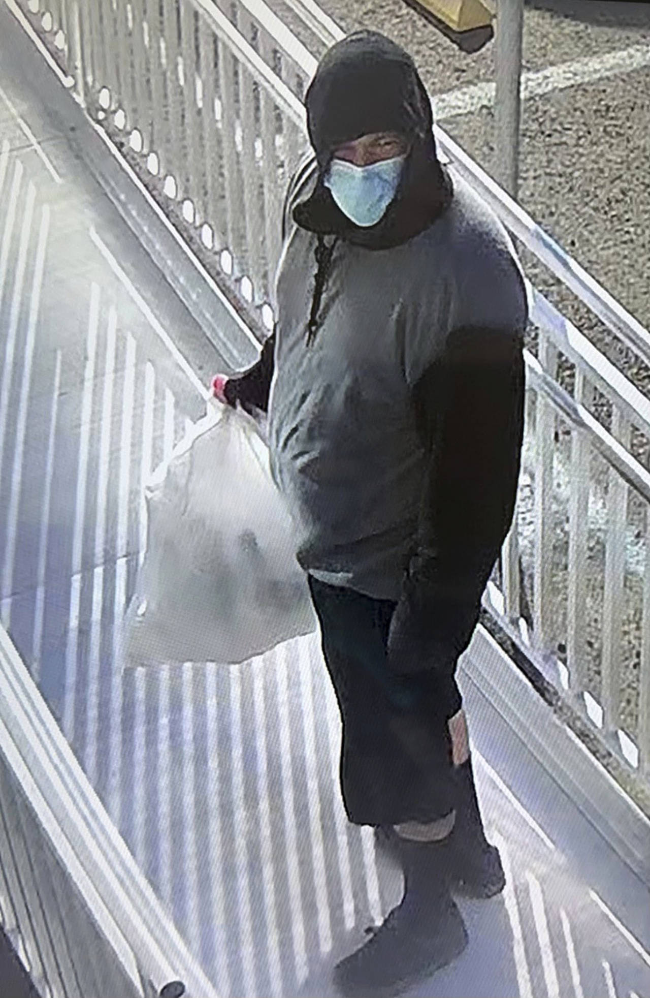 This surveillance image provided by Merced County Sheriff's Office shows a possible suspect sought ...