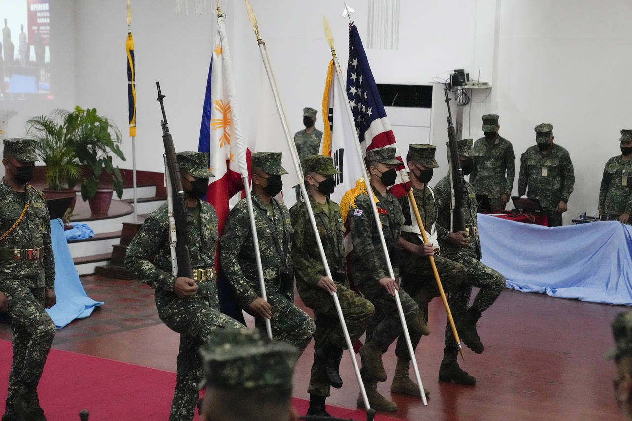 Marines from Philippines, Japan, South Korea and the United States carry their flag during opening ...