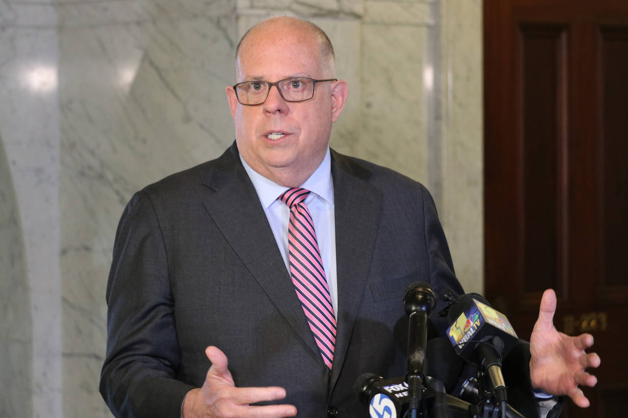 FILE - Maryland Gov. Larry Hogan talks to reporters on April, 4, 2022, in Annapolis, Md. Hogan will...