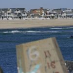 
              Houses line the beach in Manasquan, N.J., Thursday, Oct. 20, 2022. For houses along this section of the New Jersey shore, back-bay flooding, from water entering the inlet, can be as much of a concern as ocean surges during large storms. (AP Photo/Seth Wenig)
            