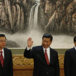 
              FILE - Communist Party General Secretary Xi Jinping, center, waves as he stands with new members of the Politburo Standing Committee Zhang Dejiang, left, and Li Keqiang in Beijing's Great Hall of the People on Nov. 15, 2012. When Xi Jinping came to power in 2012, it wasn't clear what kind of leader he would be. His low-key persona during a steady rise through the ranks of the Communist Party gave no hint that he would evolve into one of modern China's most dominant leaders, or that he would put the economically and militarily ascendant country on a collision course with the U.S.-led international order. (AP Photo/Vincent Yu, File)
            