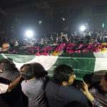
              People carry the body of a female journalist during her funeral ceremony in Lahore, Pakistan, Monday, Oct. 31, 2022. The female journalist was crushed to death Sunday in Pakistan while covering a political march led by former Prime Minister Imran Khan, a senior police officer said. (AP Photo/K.M. Chaudary)
            