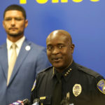 
              Stockton Police Chief Stanley McFadden, right, flanked by Stockton Mayor Kevin Lincoln, left, updates reporters about the investigation into the fatal shooting of six men and the wounding of one woman dating back to last year, during a news conference in Stockton, Calif., Tuesday, Oct. 4, 2022. (AP Photo/Rich Pedroncelli)
            