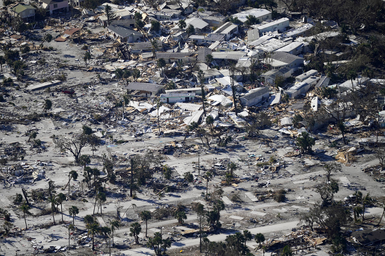 FILE - In a flight provided by mediccorps.org, debris from Hurricane Ian covers Estero Island in Fo...