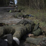 
              EDS NOTE: GRAPHIC CONTENT - Dead bodies of Russian servicemen lie on the ground in recently recaptured town of Lyman, Ukraine, Monday, Oct. 3, 2022. (AP Photo/Evgeniy Maloletka)
            