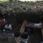 
              A place used as canteen is seen in a trench dug by Russian soldiers in a retaken area in Kherson region, Ukraine, Wednesday, Oct. 12, 2022. (AP Photo/Leo Correa)
            