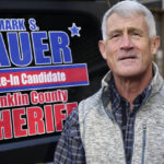 
              Franklin County write-in sheriff candidate Mark Lauer poses outside his home, Monday Oct. 3, 2022, in Colchester, Vt. Lauer, a former Vermont State Police trooper and lieutenant in the Franklin County sheriff's department, chose to mount a write-in campaign for Franklin County sheriff after the only listed candidate on the November ballot was fired from his job as a deputy sheriff after he was recorded on video kicking a shackled prisoner. (AP Photo/Wilson Ring)
            