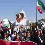 
              Demonstrators rally at the National Mall to protest against the Iranian regime, in Washington, Saturday, Oct. 22, 2022, following the death of Mahsa Amini in the custody of the Islamic republic's notorious "morality police." (AP Photo/Jose Luis Magana)
            