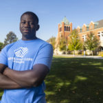 
              Steeve Biondolillo stands for a portrait on campus at Northwest Nazarene University  in Nampa, Idaho on Friday, Oct. 7, 2022. Growing up in Haiti, his desperate parents sent him at age 4 to an orphanage, where he lived for three years. “I didn’t really understand what was happening,’’ he recalls. “I just got thrown into a big house full of other kids.’’ He remembers feeling frightened and abandoned, certain he’d live there forever. (AP Photo/Kyle Green)
            