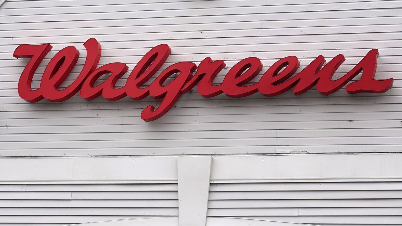 FILE - The Walgreens logo on the front of a store, July 14, 2021, in Cambridge, Mass.  Walgreens Bo...