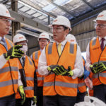 
              Mike Henry, left, CEO of BHP shows nickel briquettes to Japan's Prime Minister Fumio Kishida, center, and Australian Prime Minister Anthony Albanese, right, at the BHP Nickel West Kwinana Nickel Refinery near Perth, Australia, Saturday, Oct. 22, 2022. Kishida is on a visit to bolster military and energy cooperation between Australia and Japan amid their shared concerns about China. (Richard Wainwright/Pool Photo via AP)
            