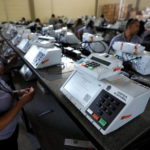 
              Electoral Court employees work on the final stage of sealing electronic voting machines in preparation for the general election run-off in Brasilia, Brazil, Wednesday, Oct. 19, 2022. The second round is set for Oct. 30. (AP Photo/Eraldo Peres)
            