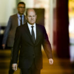 
              German Chancellor Olaf Scholz, center, walks through the foyer of the chancellery to welcome Spain's King Felipe VI for a meeting, Berlin, Germany, Monday, Oct. 17, 2022. German Chancellor Olaf Scholz has ordered preparations for all of the country's three remaining nuclear reactors to continue operating until mid-April 2023. The move marks another hiccup in the country's long-running plan to end the use of atomic energy. (AP Photo/Markus Schreiber)
            