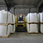 
              Shipping trainee Keenan Kinder uses a forklift to move large bags of lithium carbonate at Albemarle Corp.'s Silver Peak lithium facility, Thursday, Oct. 6, 2022, in Silver Peak, Nev. The Biden administration on Wednesday, Oct. 19, awarded $2.8 billion in grants to build and expand domestic manufacturing of batteries for electric vehicles in 12 states. A total of 20 companies, including Albemarle Corp., will receive grants for projects to extract and process lithium, graphite and other battery materials, manufacture components and strengthen U.S. supply of critical minerals, officials said. (AP Photo/John Locher)
            