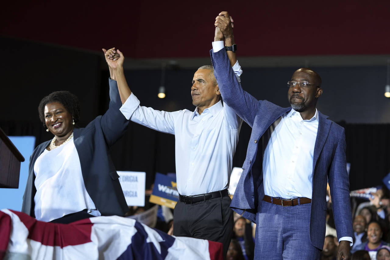 Former President Barack Obama, center, stands with Georgia gubernatorial candidate Stacey Abrams an...