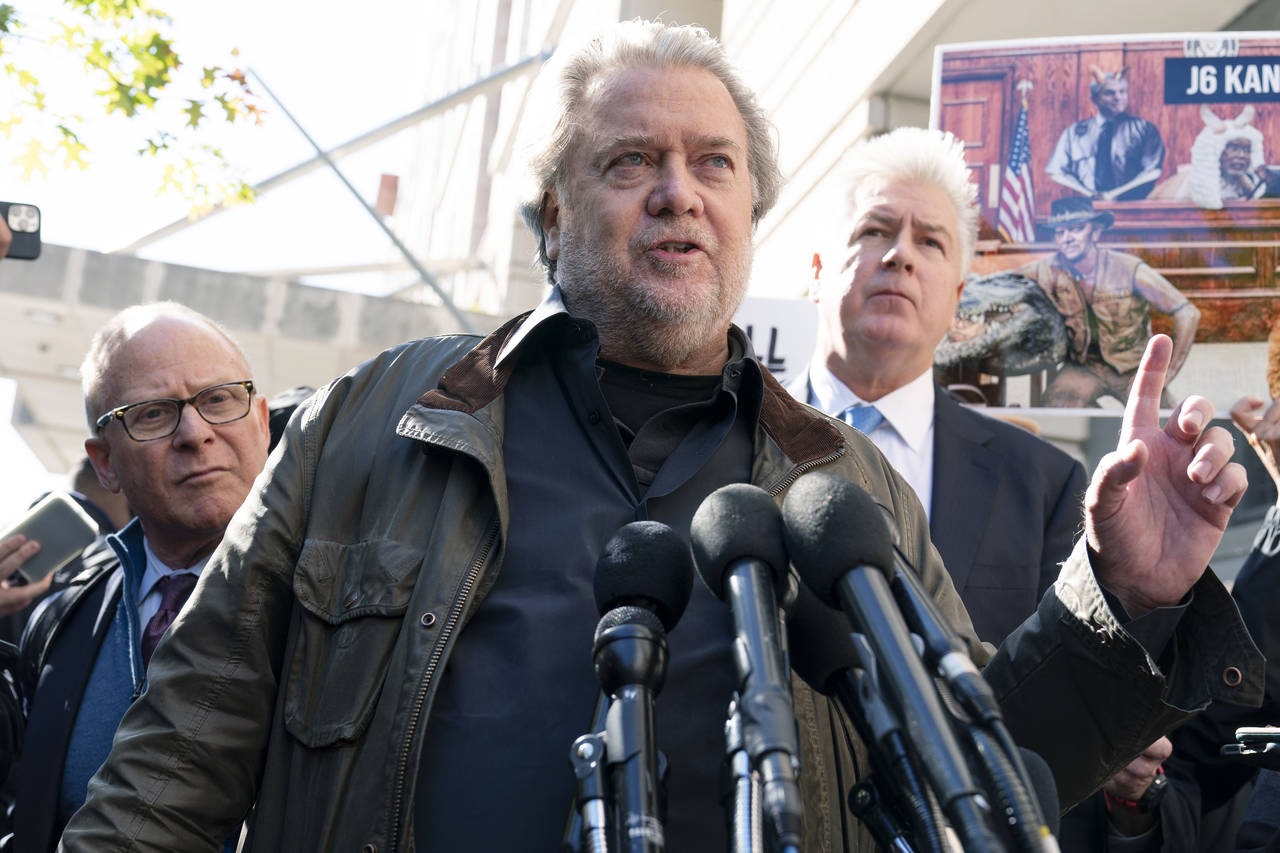 Steve Bannon, center, a longtime ally of former President Donald Trump and convicted of contempt of...