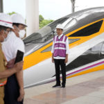 
              Indonesian President Joko Widodo stands near a newly-unveiled Comprehensive Inspection Train (CIT) unit during his visit at the construction site of a Jakarta-Bandung Fast Railway station in Tegalluar, West Java, Indonesia, Thursday, Oct. 13, 2022. The 142-kilometer (88-mile) high-speed railway worth $5.5 billion is being constructed by PT Kereta Cepat Indonesia-China, a joint venture between an Indonesian consortium of four state-owned companies and China Railway International Co. Ltd. The joint venture says the trains that will be the fastest in Southeast Asia. (AP Photo/Dita Alangkara)
            