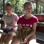 
              Ukrainian children Olesya Lyadchenko, left, and Yaroslava Rogachyova attend a camp in Zolotaya Kosa, the settlement on the Sea of Azov, Rostov region, southwestern Russia, Friday, July 8, 2022. An Associated Press investigation has found that Russia’s strategy to take Ukrainian orphans and bring them up as Russian is well underway. Yaroslava said she will miss the sea and Donetsk, but she has already met – only via video link by then her new family and likes them. (AP Photo)
            