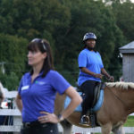 
              Dionne Williamson, right, of Patuxent River, Md., participates in a riding lesson at Cloverleaf Equine Center in Clifton, Va., Tuesday, Sept. 13, 2022, as Equine Coordinator Clarice Gutman, left, works with another rider. After finishing a tour in Afghanistan in 2013, Williamson, experienced disorientation, depression, memory loss and chronic exhaustion. “It’s like I lost me somewhere,” said the Navy lieutenant commander. After fighting for years to get the help she needed, she eventually found stability through a monthlong hospitalization and a therapeutic program that incorporates horseback riding. (AP Photo/Susan Walsh)
            