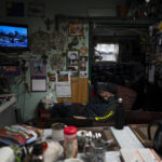
              Rich Stasenko, 81, watches news of hurricane-ravaged Florida in his home in Shishmaref, Alaska, Wednesday, Oct. 5, 2022. The people of Shishmaref "are resourceful, they are resilient," said Stasenko, who arrived to Shishmaref to teach at the local school in the mid-'70s and never left. "I don't see victims here." (AP Photo/Jae C. Hong)
            