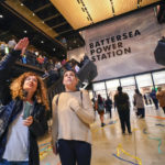 
              People walk in the Battersea Power Station on the day of its official opening to the public, in London, Friday, Oct. 14, 2022. A former power station on the bank of the River Thames that was left derelict for decades is opening Friday after a 9 billion-pound ($10 billion) redevelopment turning the south London site into a new attraction complete with shops, bars and hundreds of apartments. (AP Photo/Alberto Pezzali)
            