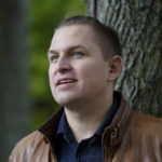 
              Opera singer Ilya Silchukou stands for a photograph at a park in a suburb of Boston, Tuesday, Oct. 4, 2022. Silchukou was a cultural icon in his native Belarus, the lead soloist at the State Opera Bolshoi who represented his nation at official government functions at home and abroad and performed at opera houses all over Europe. He lived a privileged and comfortable life in his homeland, but gave it up after joining tens of thousands of Belarusians at election protests that were violently suppressed by the Lukashenko government. (AP Photo/Steven Senne)
            