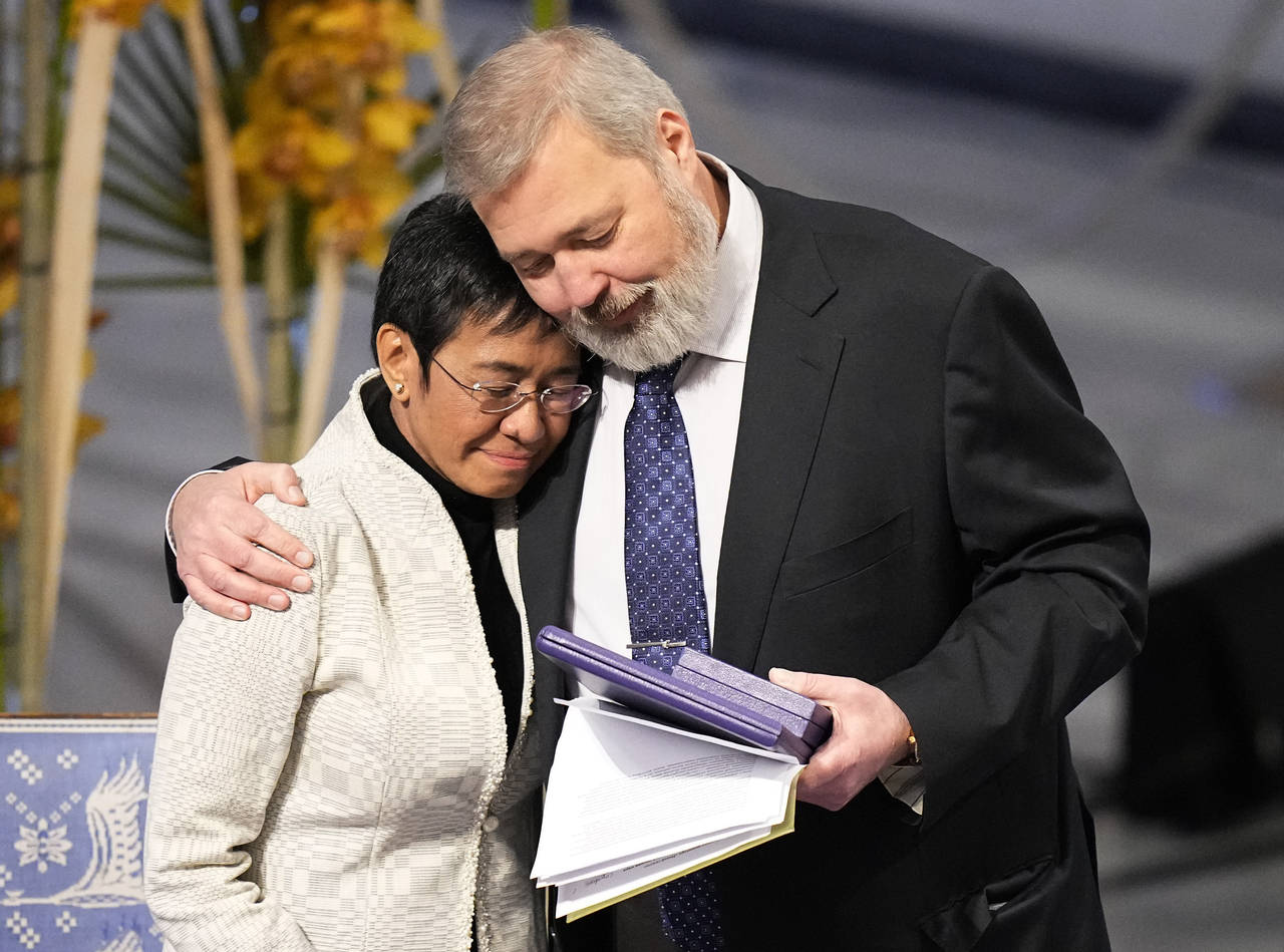 FILE - Nobel Peace Prize winners Dmitry Muratov from Russia, right, and Maria Ressa of the Philippi...