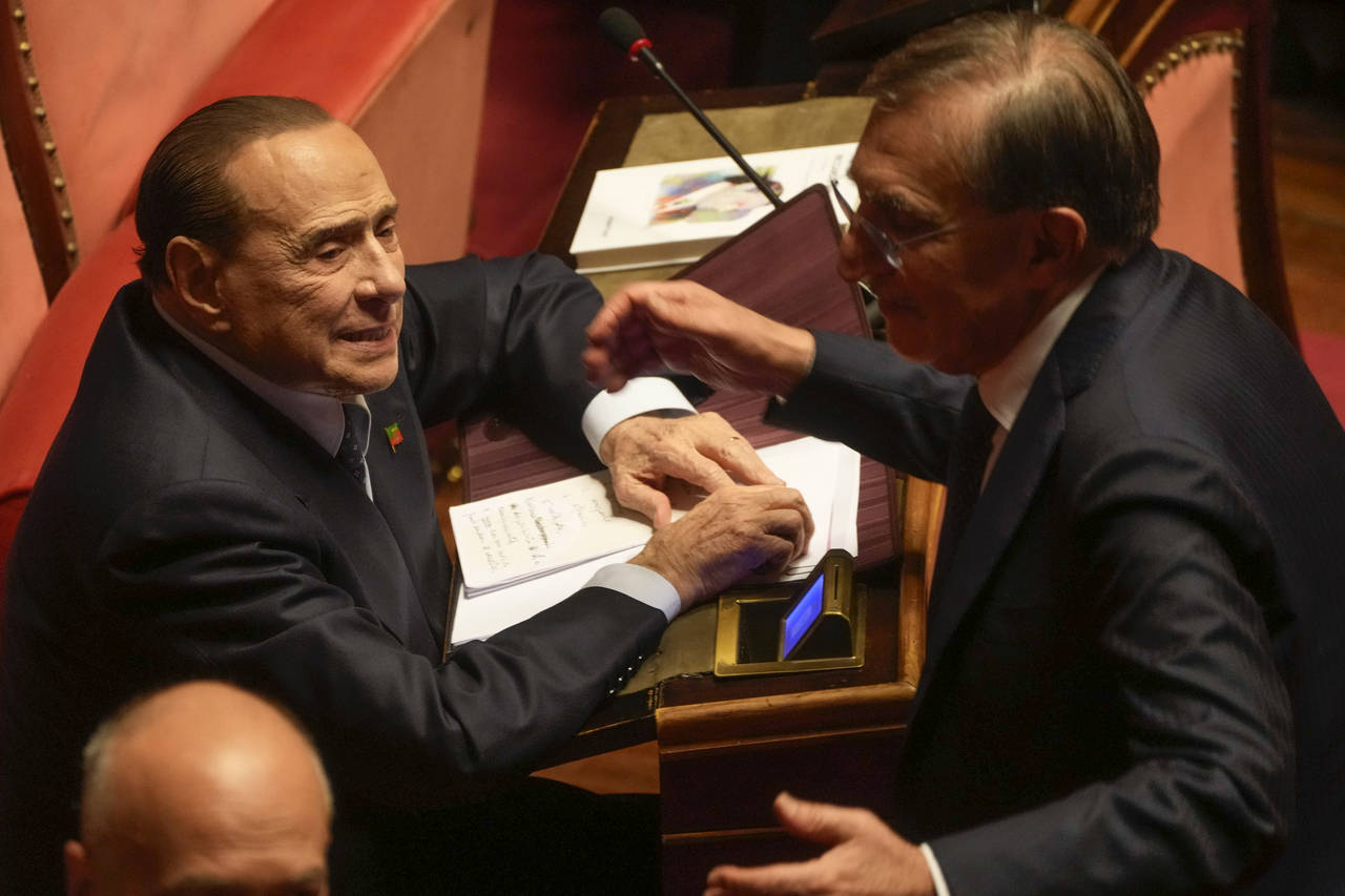 Forza Italia's president Silvio Berlusconi, left, listens to Brothers of Italy's Ignazio Larissa in...