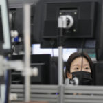 
              A currency trader watches computer monitors at a foreign exchange dealing room in Seoul, South Korea, Tuesday, Oct. 25, 2022. Shares advanced Tuesday in Asia after Wall Street shook off an early bout of unsettled trading and ended higher. (AP Photo/Lee Jin-man)
            