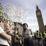 
              Demonstrators take part in the March of the Mummies national protest in central London, Saturday, Oct. 29 2022. The protest is organized by Pregnant Then Screwed to demand Government reform on childcare, parental leave and flexible working. (Aaron Chown/PA via AP)
            